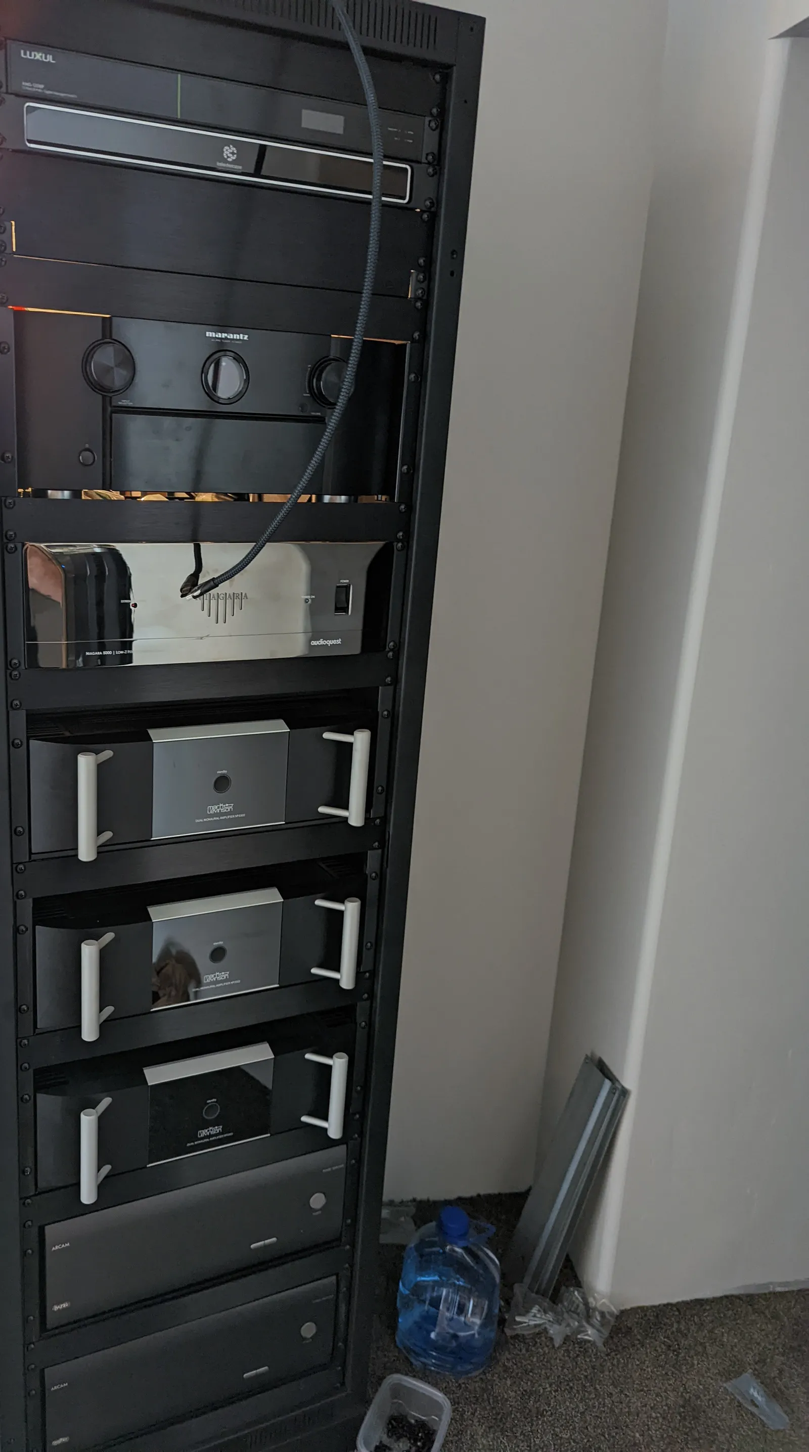 Equipment rack with movie server, processor, power conditioner, and reference monoblock amplifiers