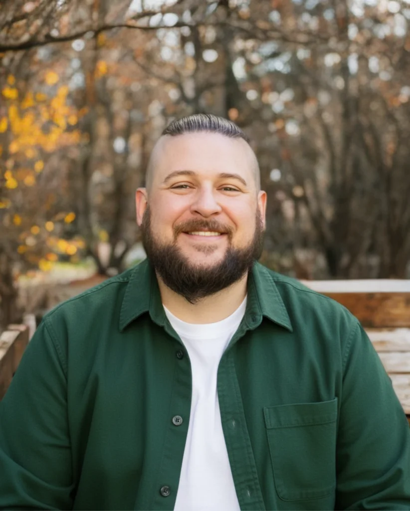 Trent Dutt, Cofounder and General Manager of Akita AV, outdoors among autumn trees
